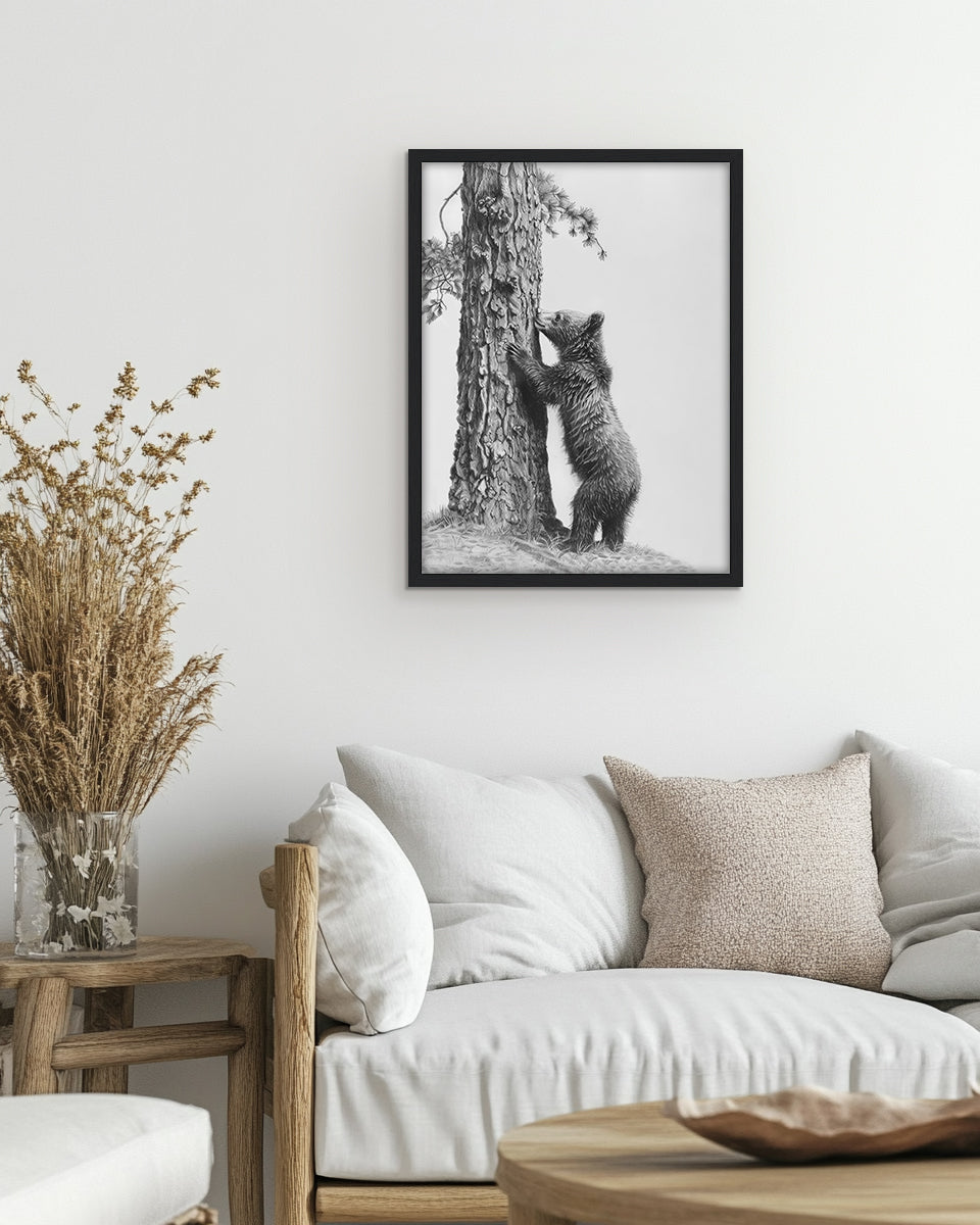 Wall art featuring a pencil illustration of a bear climbing a tree