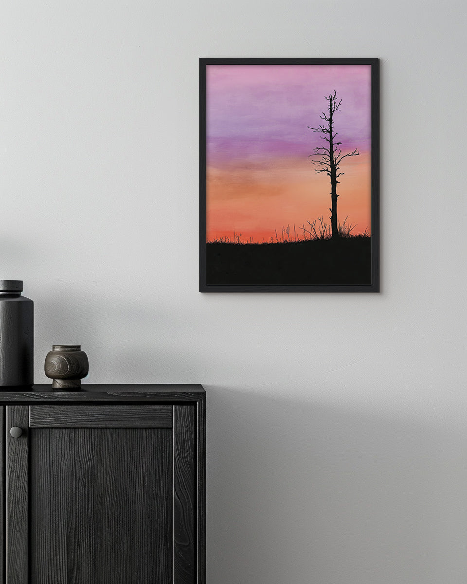 Wall art featuring a silhouette of a tree against a pink and orange sunset sky